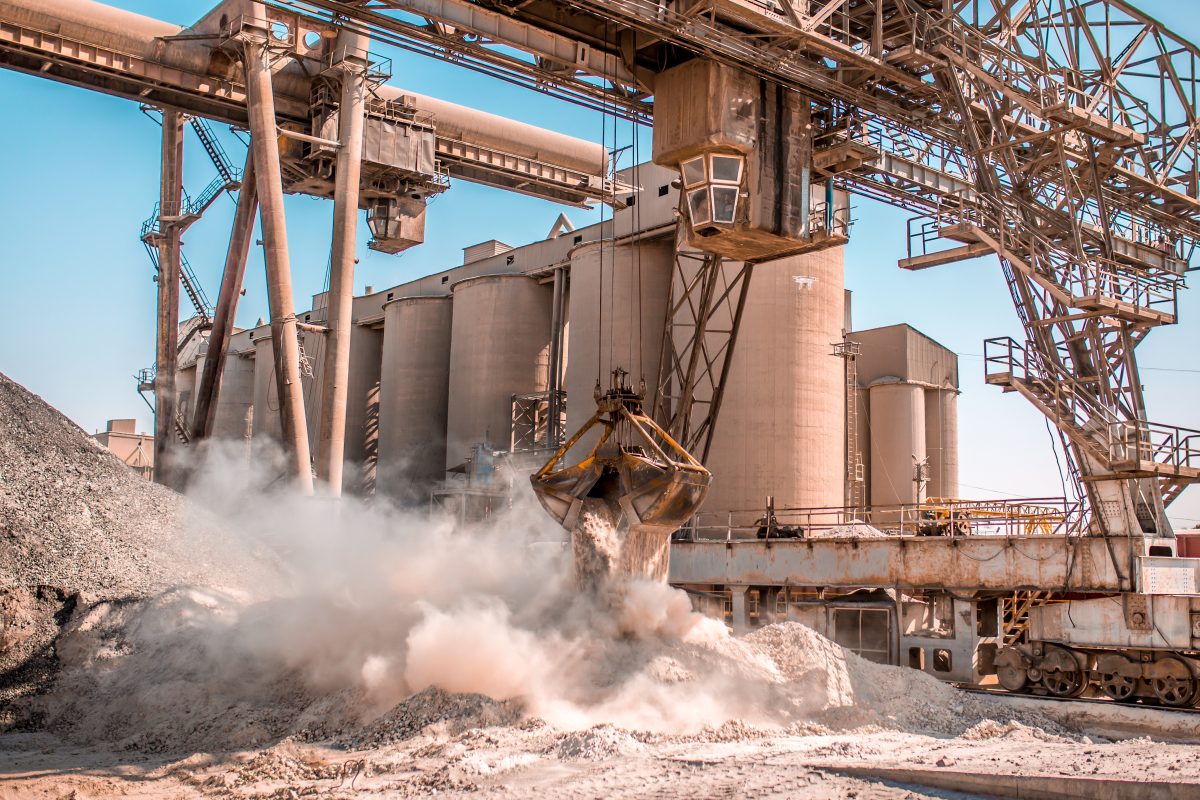 Bucket loader moving gravel at a cement plant