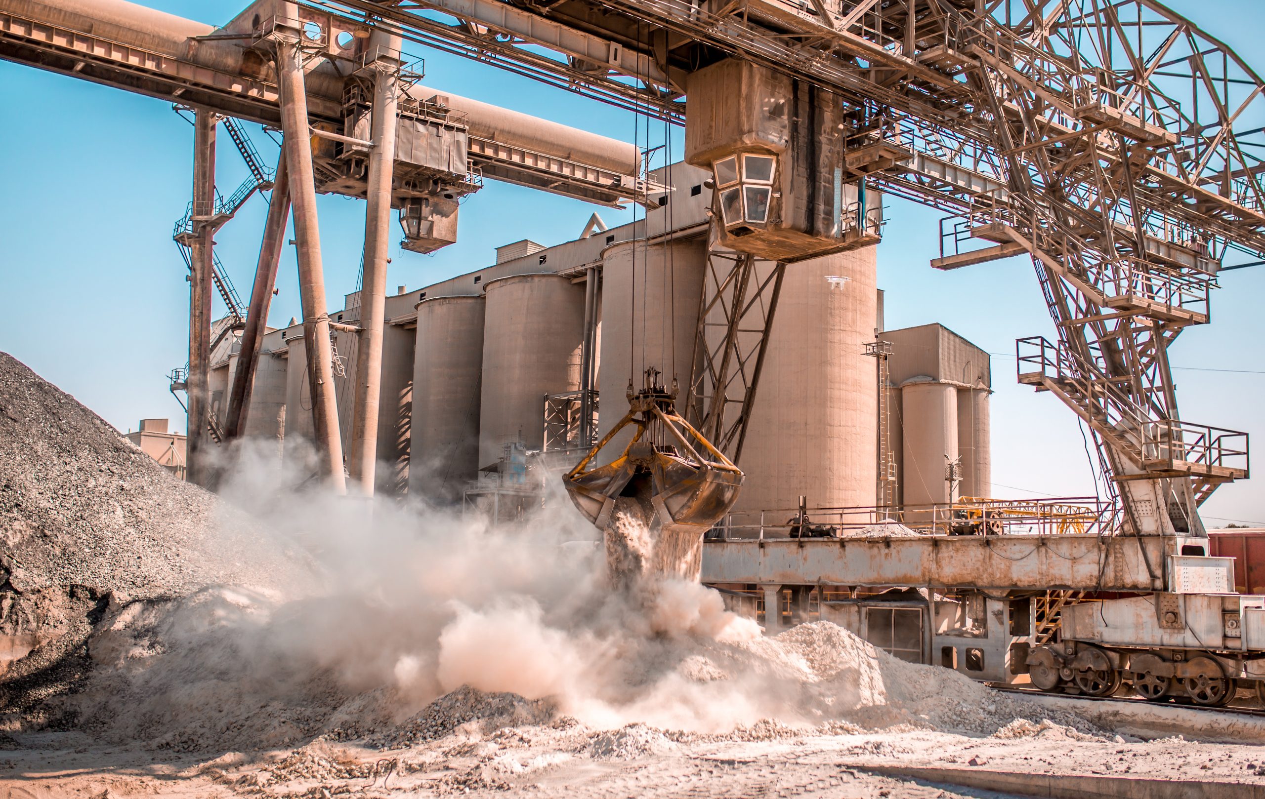 Bucket loader moving gravel at a cement plant