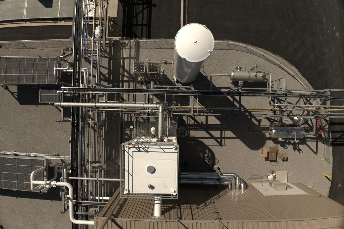 Aerial view of landfill gas upgrading equipment, storage vessel, and piping \u2014 New Hampshire
